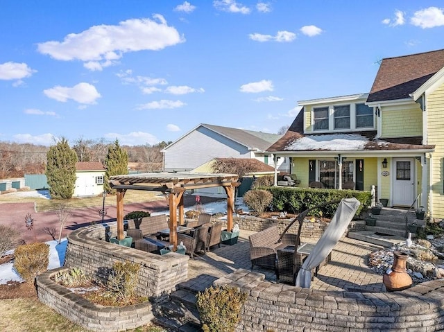 view of patio featuring outdoor lounge area and a pergola