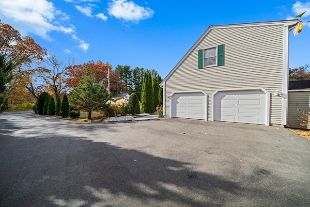 view of property exterior featuring a garage