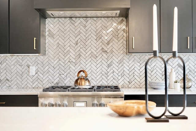 kitchen featuring decorative backsplash and range hood