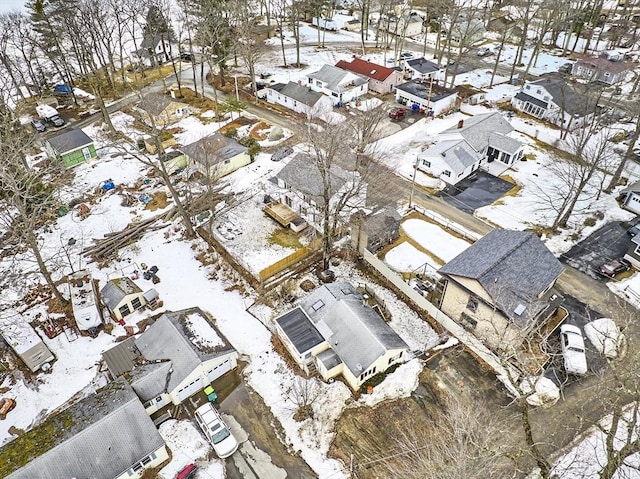 snowy aerial view with a residential view