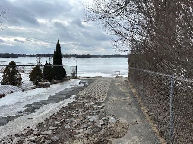 water view featuring fence