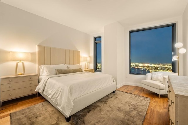 bedroom with hardwood / wood-style floors