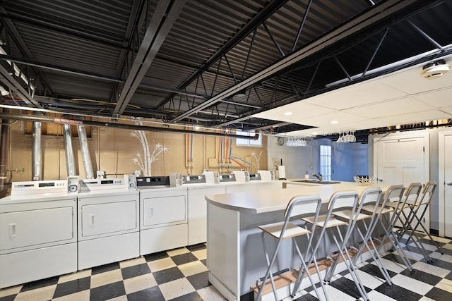 laundry room with light floors and independent washer and dryer