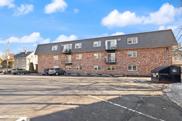 view of property with uncovered parking