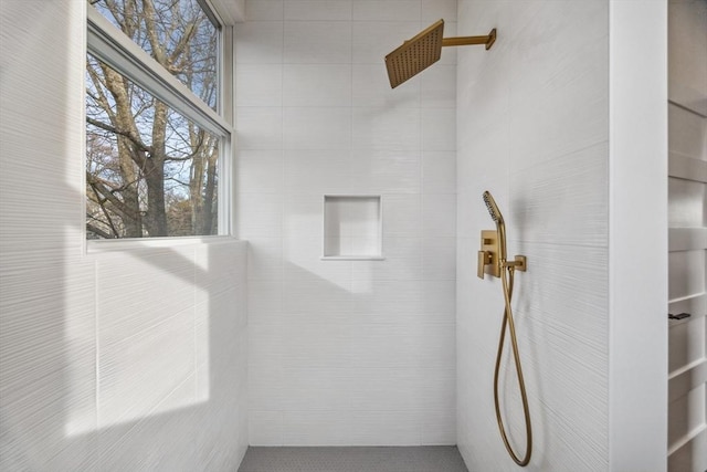 bathroom with a tile shower