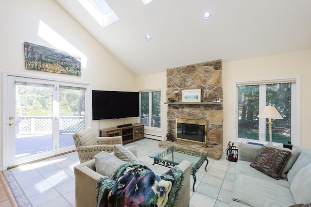 8 Fieldstone Ln, Natick, MA 01760 - tiled living room featuring a stone fireplace, a baseboard radiator, a healthy amount of sunlight, and high vaulted ceiling