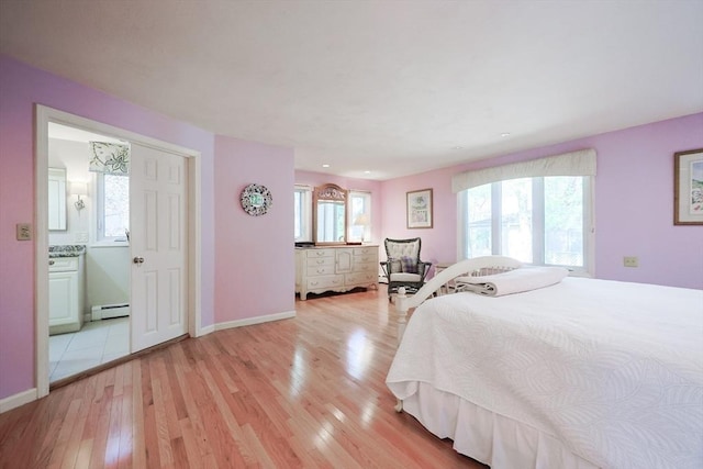 8 Fieldstone Ln, Natick, MA 01760 - bedroom with baseboards, light wood-style flooring, ensuite bath, and baseboard heating