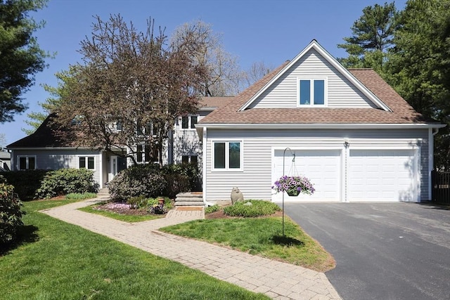 8 Fieldstone Ln, Natick, MA 01760 - view of front facade with a garage, a front lawn, and roof with shingles