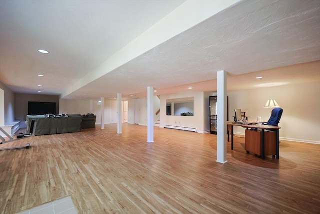 8 Fieldstone Ln, Natick, MA 01760 - finished basement with wood finished floors, recessed lighting, baseboards, and a baseboard heating unit