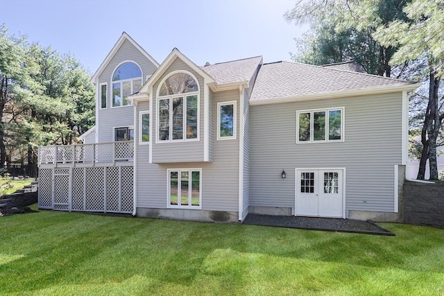 8 Fieldstone Ln, Natick, MA 01760 - rear view of property with a lawn and roof with shingles
