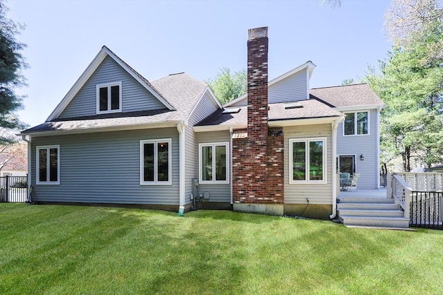 8 Fieldstone Ln, Natick, MA 01760 - back of house with a lawn, fence, a chimney, and a deck