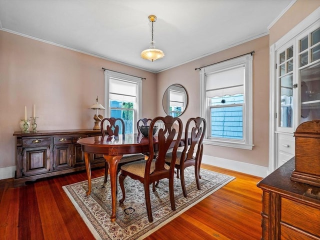 28 Albano St, Boston, MA 02131 - dining area featuring dark wood finished floors, ornamental molding, and baseboards