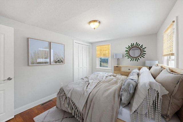 bedroom featuring hardwood / wood-style flooring and a closet