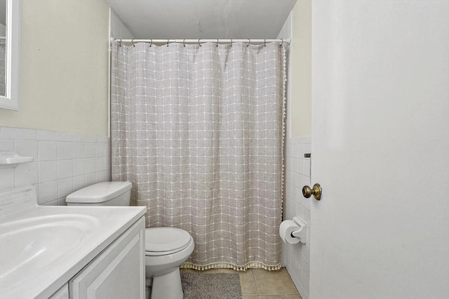 80 N Warren St Unit 14, Woburn, MA 01801 - full bath featuring tile walls, tile patterned flooring, vanity, a wainscoted wall, and a shower with curtain