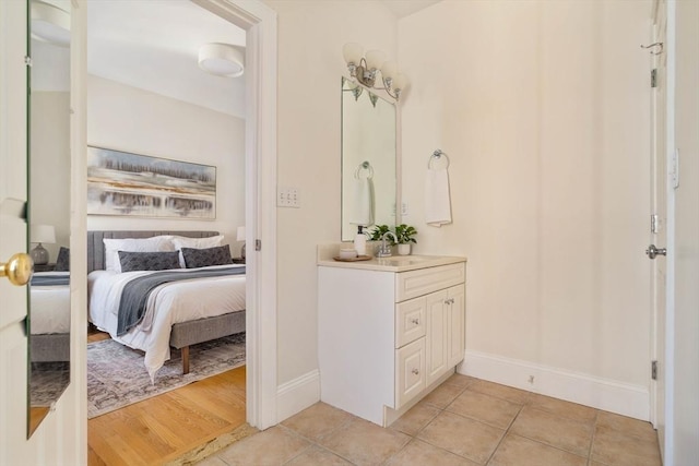 bathroom with vanity and tile patterned flooring