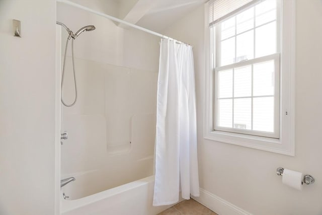 bathroom with tile patterned flooring and shower / bath combination with curtain