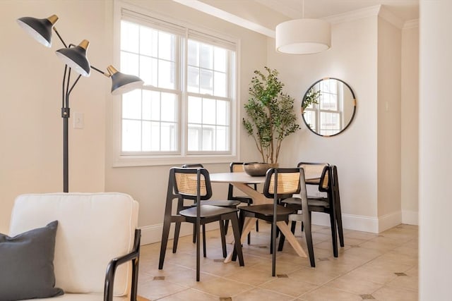 dining area featuring light tile patterned floors and ornamental molding