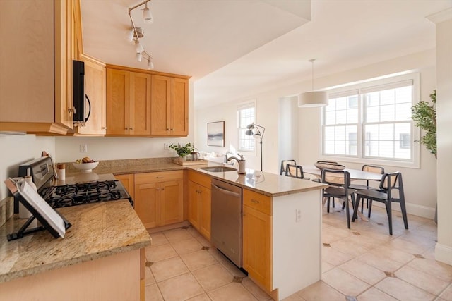 kitchen with pendant lighting, stainless steel appliances, sink, kitchen peninsula, and light tile patterned floors