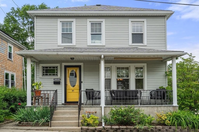 41 Bancroft St, Watertown, MA 02472 - view of front of home with covered porch and a shingled roof