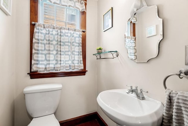 41 Bancroft St, Watertown, MA 02472 - bathroom with a sink, toilet, and baseboards