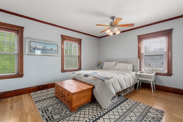 41 Bancroft St, Watertown, MA 02472 - bedroom with baseboards, light wood finished floors, ornamental molding, and a ceiling fan