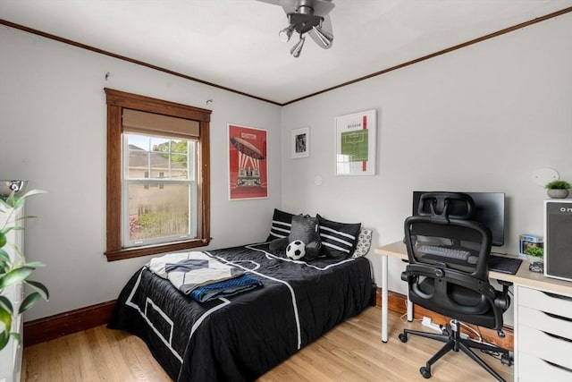 41 Bancroft St, Watertown, MA 02472 - bedroom with light wood-type flooring, crown molding, baseboards, and a desk
