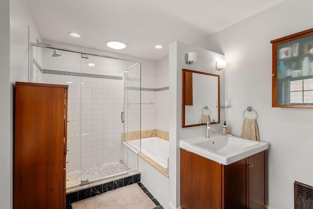 41 Bancroft St, Watertown, MA 02472 - full bath featuring a garden tub, a shower stall, vanity, tile patterned floors, and recessed lighting