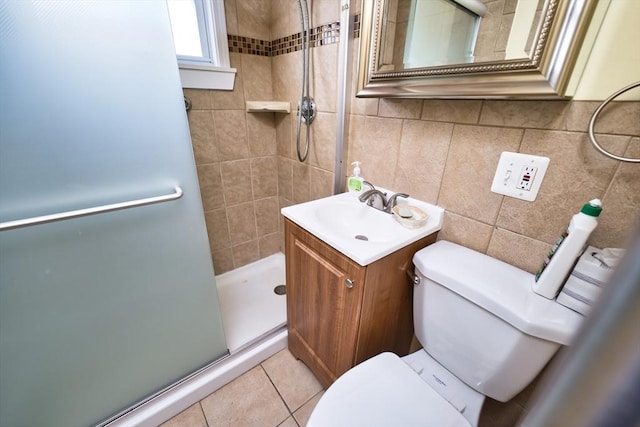 101 Cory St, Fall River, MA 02720 - full bathroom with toilet, a shower stall, tile walls, vanity, and tile patterned floors