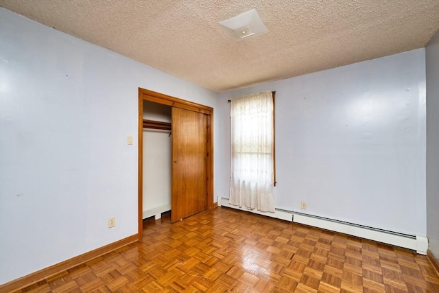 101 Cory St, Fall River, MA 02720 - unfurnished bedroom featuring baseboards, a textured ceiling, a baseboard heating unit, and a closet