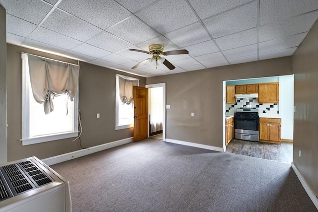 101 Cory St, Fall River, MA 02720 - unfurnished living room featuring dark colored carpet, ceiling fan, baseboards, and a drop ceiling