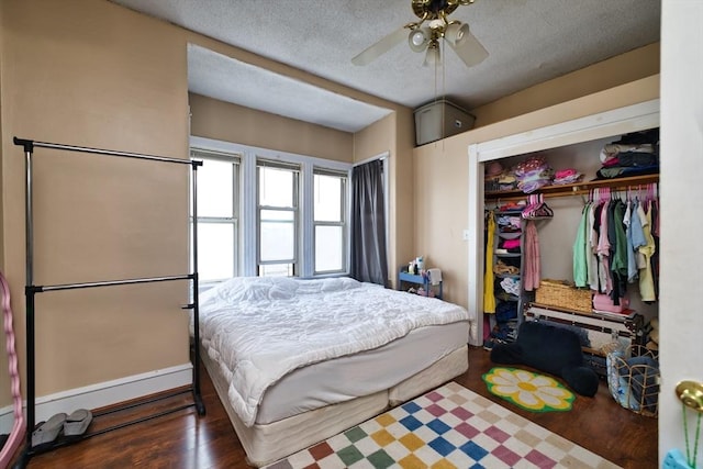 101 Cory St, Fall River, MA 02720 - bedroom with a closet, wood finished floors, a textured ceiling, and a ceiling fan