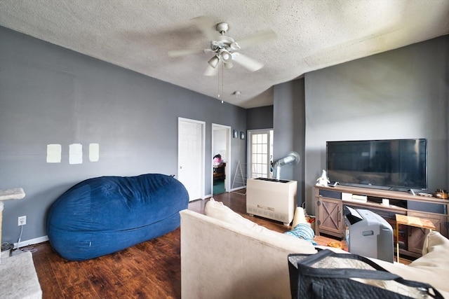 101 Cory St, Fall River, MA 02720 - living area featuring a ceiling fan, a textured ceiling, wood finished floors, and baseboards