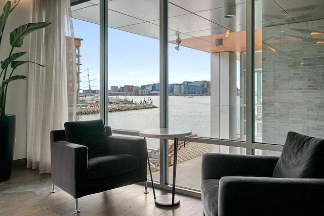 community lobby featuring a city view and a water view