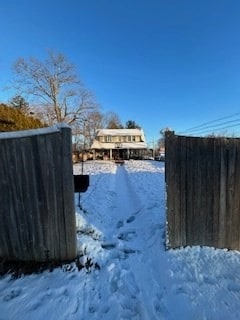 view of yard layered in snow