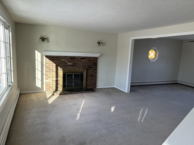 unfurnished living room with a textured ceiling, a fireplace, carpet flooring, baseboards, and baseboard heating