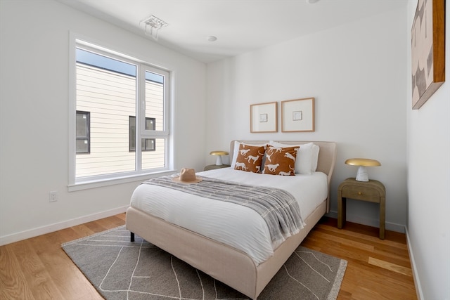 bedroom featuring hardwood / wood-style flooring