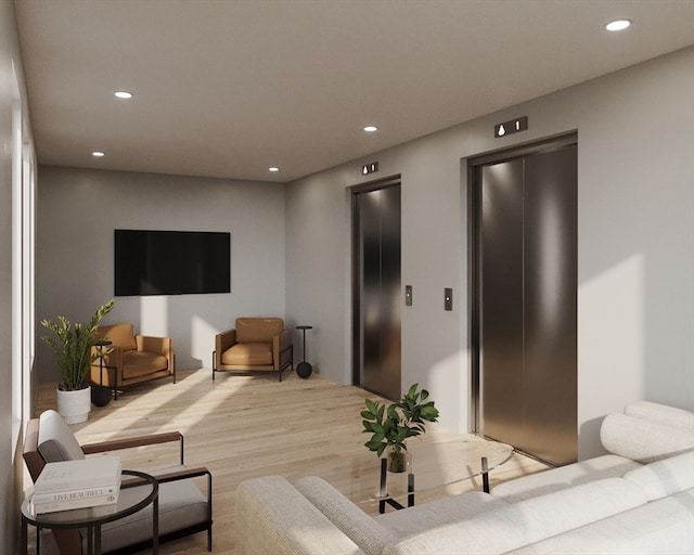 living room with light hardwood / wood-style floors and elevator