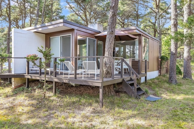 rear view of property with a deck