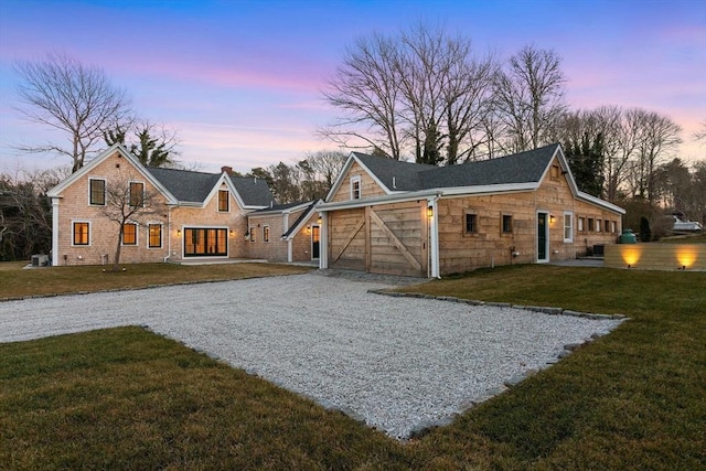 540 S Orleans, Orleans, MA 02653 - back of property at dusk with a lawn and driveway