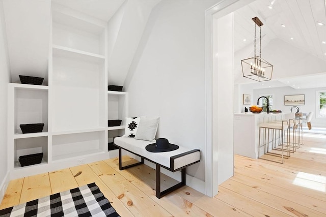540 S Orleans, Orleans, MA 02653 - hall featuring light wood-type flooring, high vaulted ceiling, and a chandelier