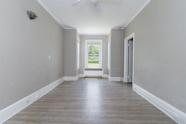 1 Commonwealth Ave, Sturbridge, MA 01518 - unfurnished room with radiator heating unit, ceiling fan, ornamental molding, and wood finished floors
