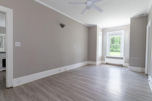 1 Commonwealth Ave, Sturbridge, MA 01518 - empty room with radiator heating unit, wood finished floors, ceiling fan, and crown molding
