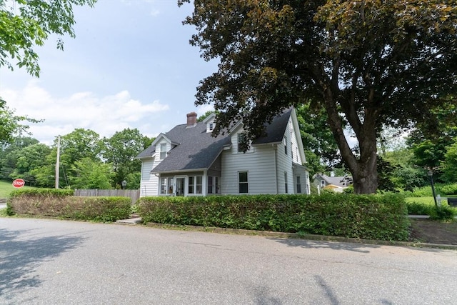 1 Commonwealth Ave, Sturbridge, MA 01518 - view of front of property with a chimney and roof with shingles
