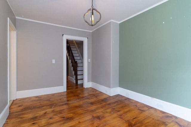1 Commonwealth Ave, Sturbridge, MA 01518 - empty room with hardwood / wood-style floors, ornamental molding, stairs, and a chandelier