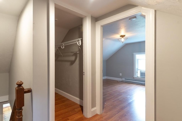 1 Commonwealth Ave, Sturbridge, MA 01518 - additional living space with baseboard heating, lofted ceiling, and wood finished floors