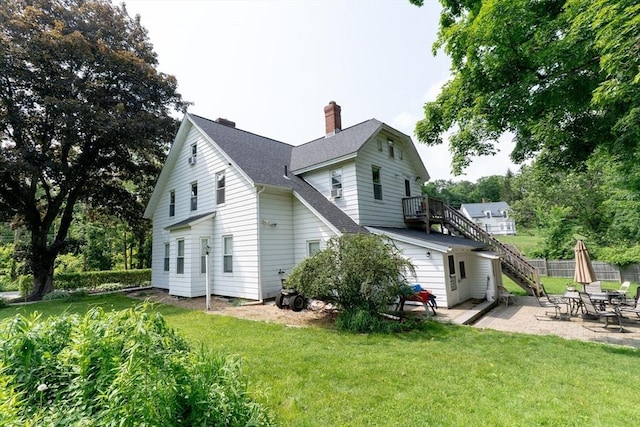 1 Commonwealth Ave, Sturbridge, MA 01518 - view of side of home with stairway, a patio area, a chimney, and a shingled roof