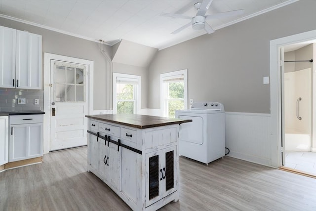 1 Commonwealth Ave, Sturbridge, MA 01518 - laundry area with washer / clothes dryer, ornamental molding, light wood-style floors, a ceiling fan, and a wainscoted wall