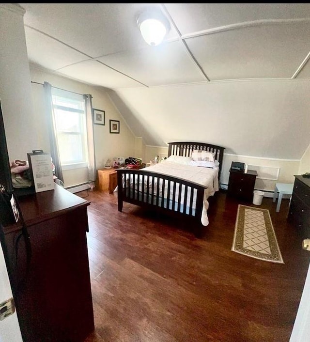 bedroom featuring lofted ceiling, dark wood-type flooring, and baseboard heating