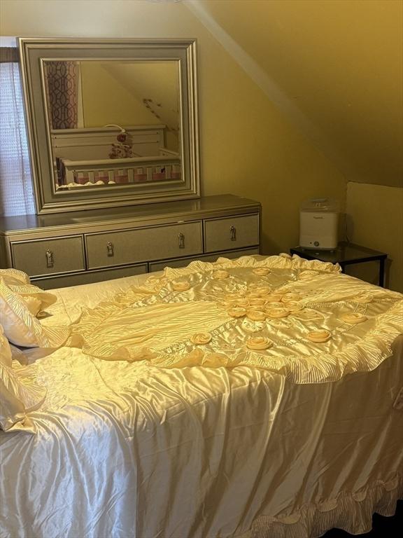 bedroom featuring vaulted ceiling