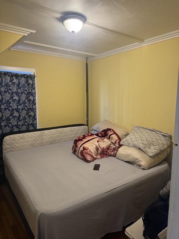 bedroom with ornamental molding